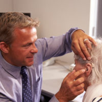 A patient being fitted with a hearing aid