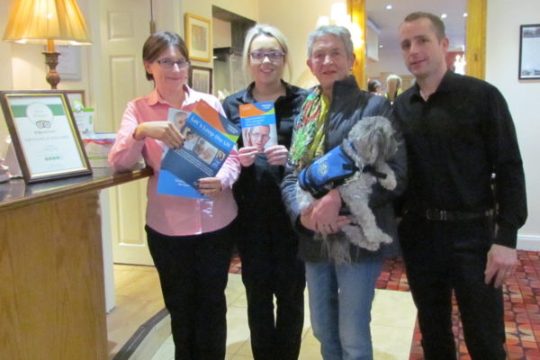 Volunteer Mary O'Brien with staff in Drummond Hotel, Ballykelly