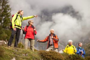 a number of people hiking wearing colourful jackets