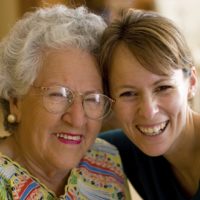 Elderly woman and younger woman volunteering
