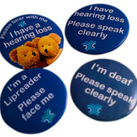 A set of badges informing that the wearer has a hearing loss