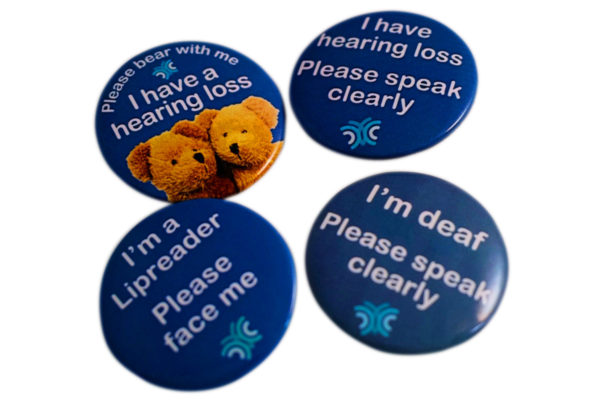 A set of badges informing that the wearer has a hearing loss
