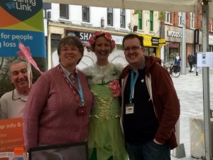 Hearing Link staff pose for a photo with Fizzy the Fairy
