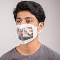 Man wearing a lipreading friendly transparent mask