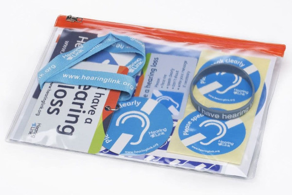 Ziplock bag of stickers, cards, badges and other personal awareness items.