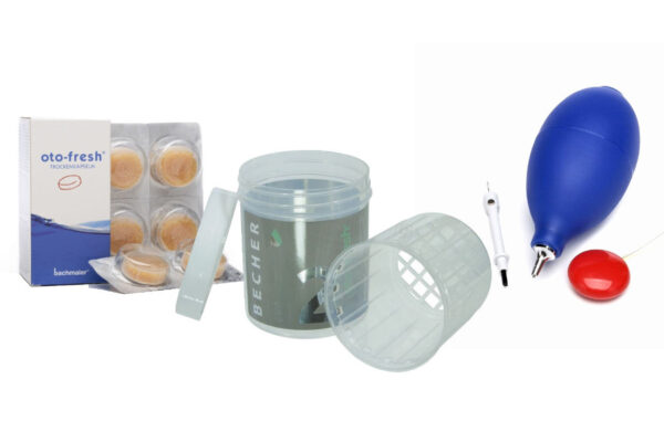 hearing aid drying beaker with replacement capsules and a blue earmould puffer