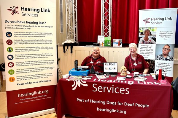 Hearing Link Services volunteers at an information event