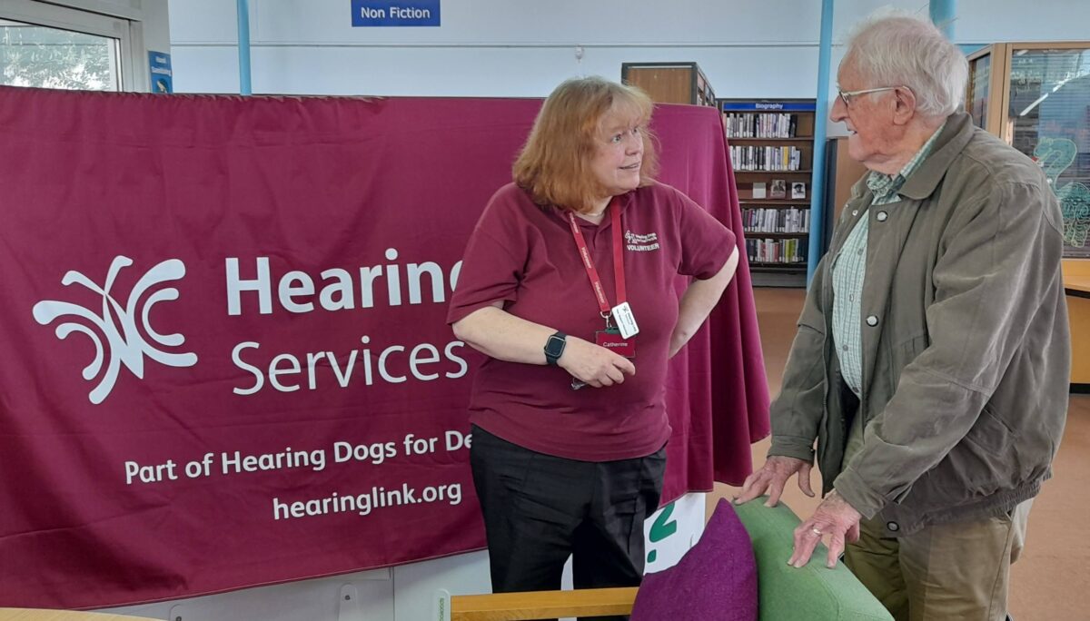 Peer support volunteer offering advice at a Hearing Support Session