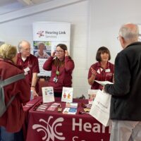Hearing Link Services stands at September 2023's Hearing Information Day