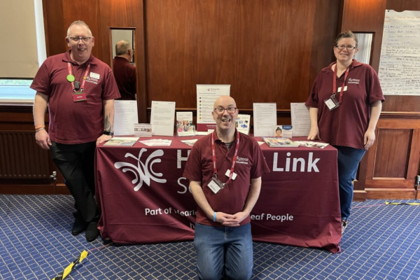 Three peer support volunteers providing guidance for hearing loss